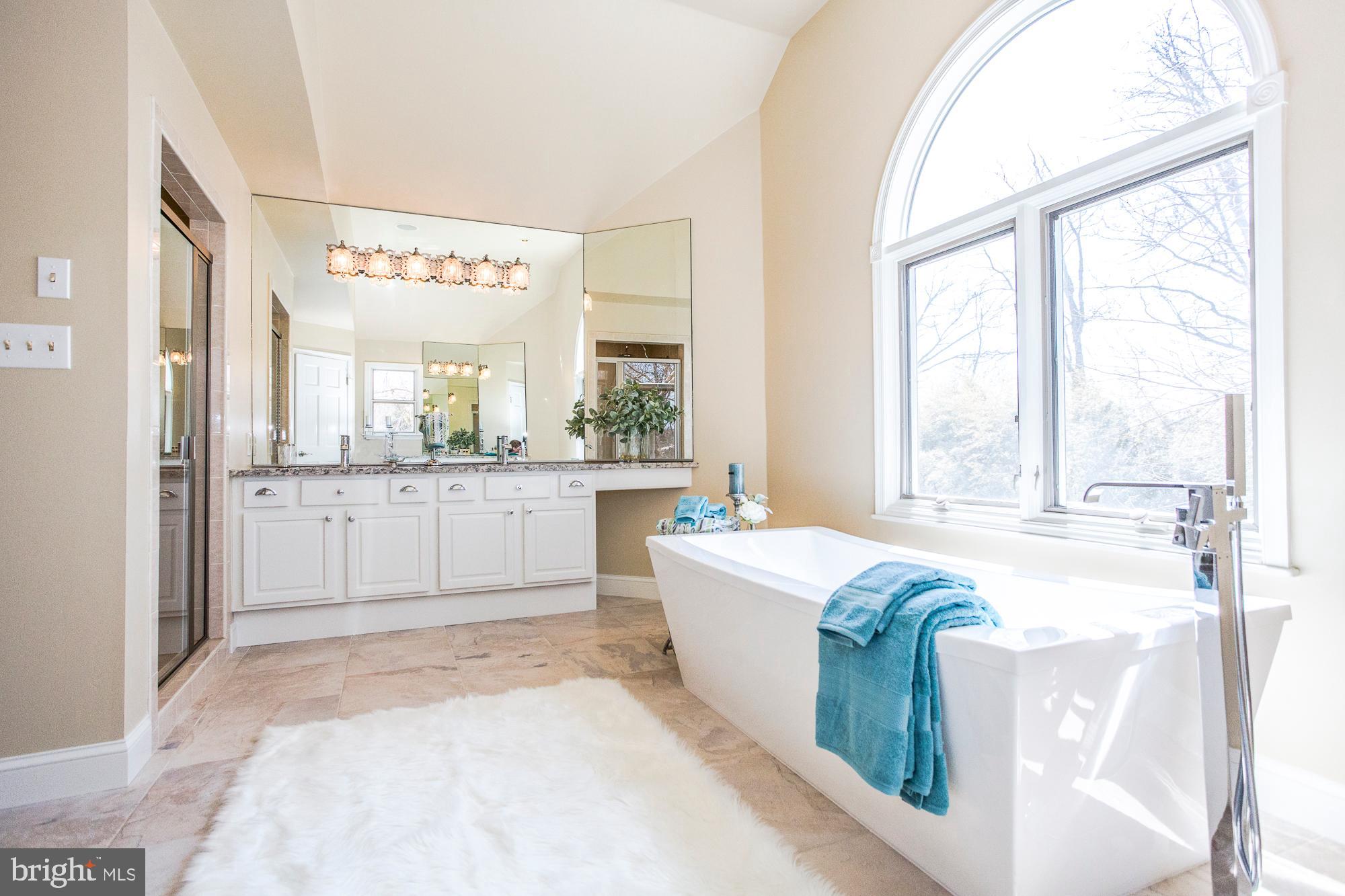 2565 Cold Spring Road Lansdale, PA 19446 - Photo 33 of 61 a large white tub sitting in a bathroom next to a window