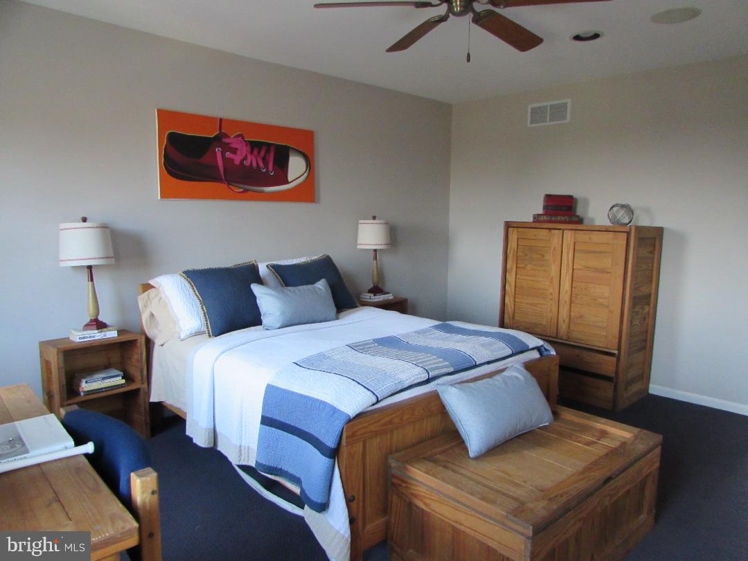 2565 Cold Spring Road Lansdale, PA 19446 - Photo 36 of 61 a bedroom with a bed and a chandelier