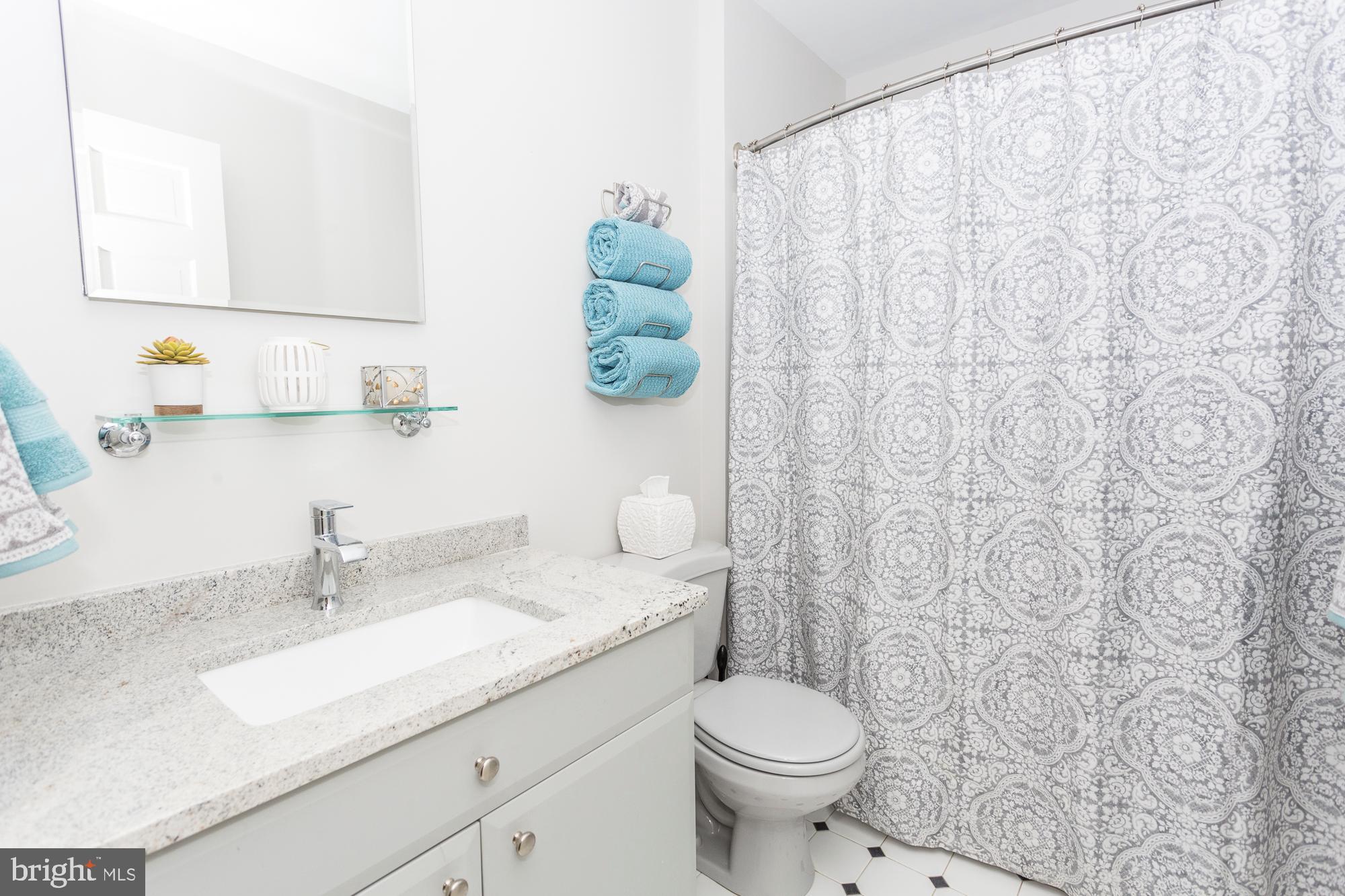 2565 Cold Spring Road Lansdale, PA 19446 - Photo 37 of 61 a bathroom with a granite countertop sink and a mirror