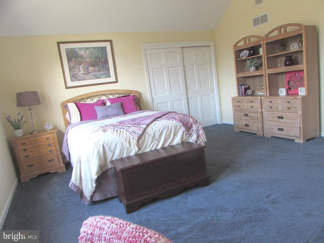 2565 Cold Spring Road Lansdale, PA 19446 - Photo 39 of 61 a bedroom with a bed and a book shelf