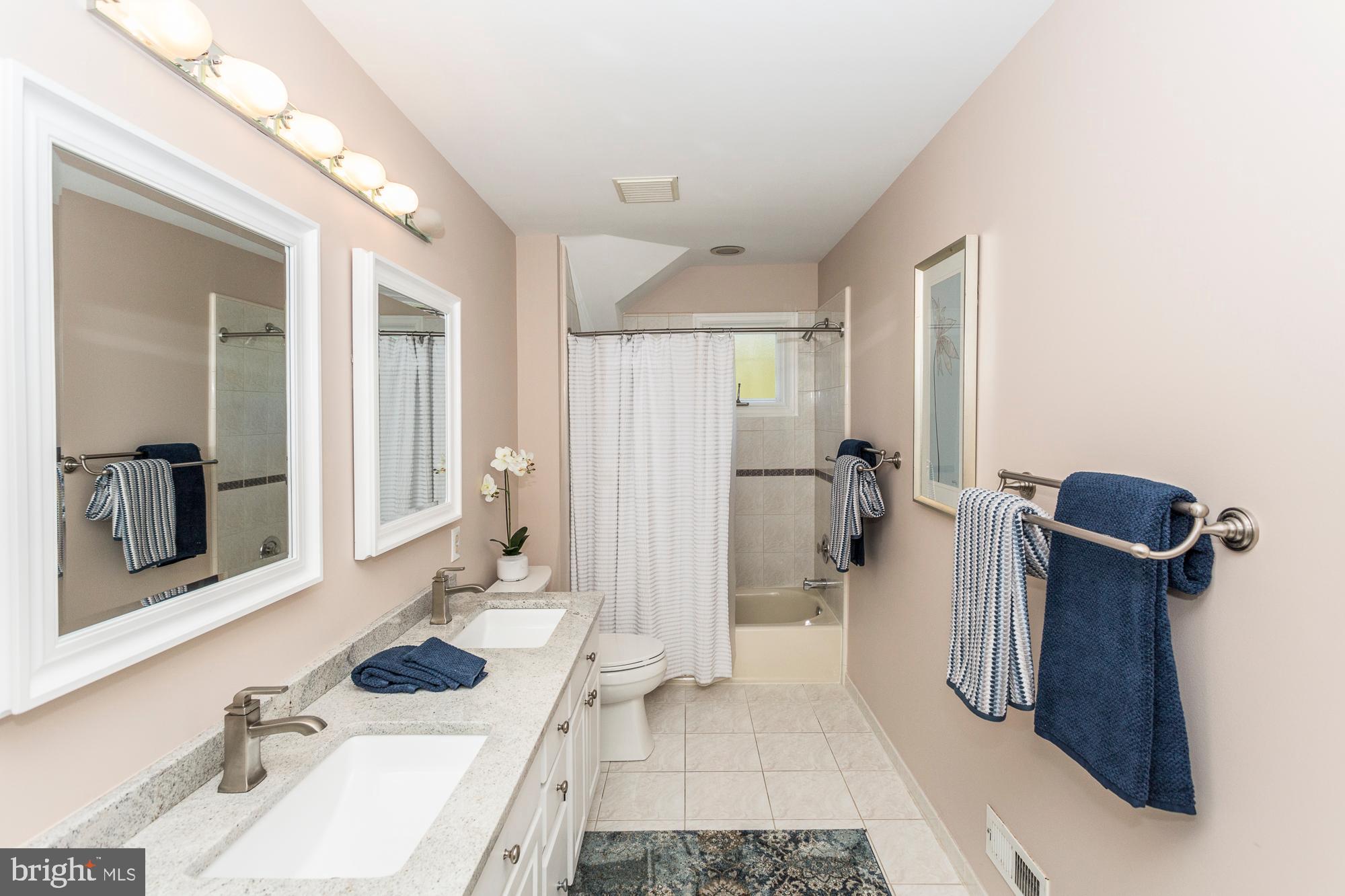 2565 Cold Spring Road Lansdale, PA 19446 - Photo 40 of 61 a bathroom with a sink and mirror with toilet