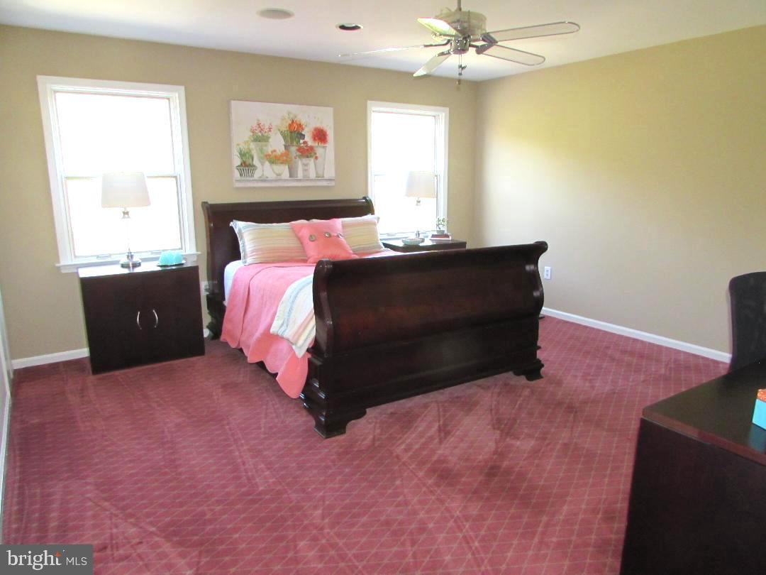 2565 Cold Spring Road Lansdale, PA 19446 - Photo 41 of 61 a bed sitting in a bedroom next to a window