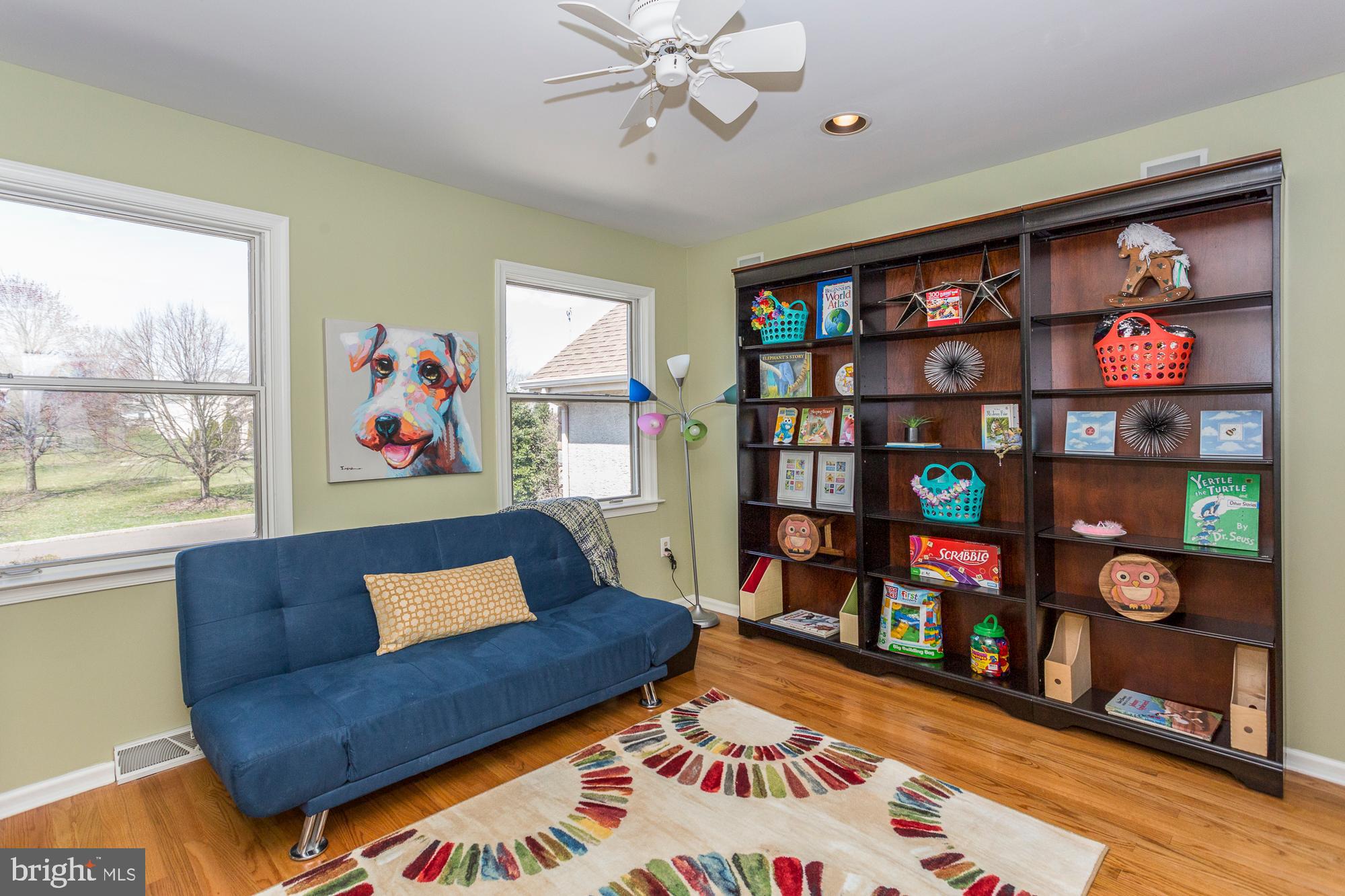 2565 Cold Spring Road Lansdale, PA 19446 - Photo 42 of 61 a living room with furniture a bookshelf and a window