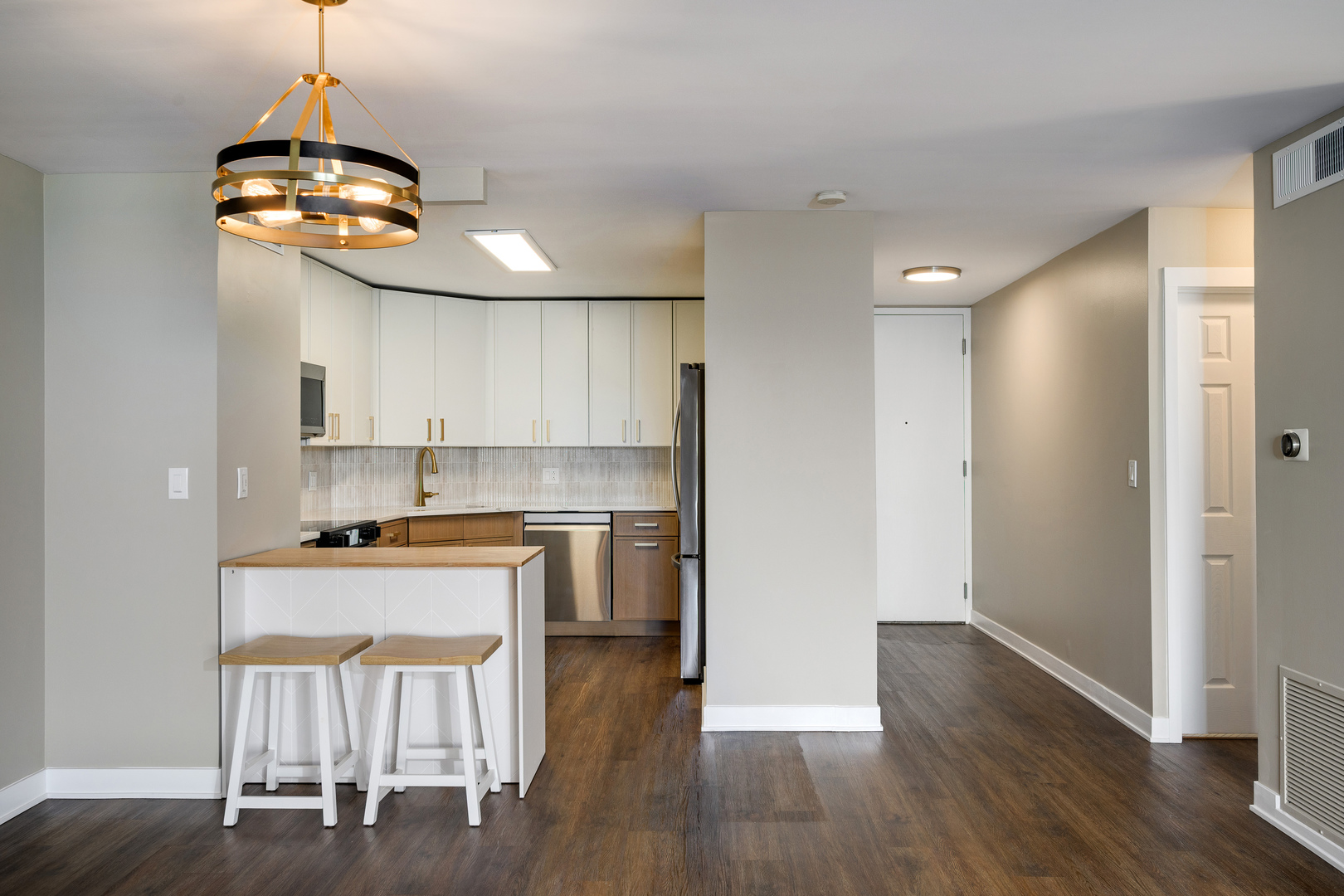 6033 North Sheridan Road, Unit 18K Chicago, IL 60660 - Photo 13 of 36 a kitchen with stainless steel appliances granite countertop a stove and a refrigerator