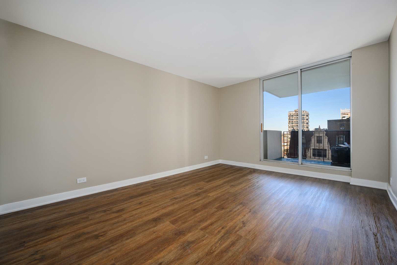 6033 North Sheridan Road, Unit 18K Chicago, IL 60660 - Photo 22 of 36 a view of a room with wooden floor