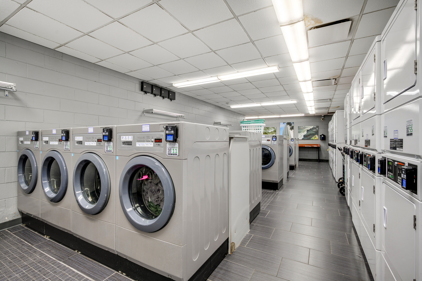 6033 North Sheridan Road, Unit 18K Chicago, IL 60660 - Photo 28 of 36 a utility room with dryer and washer