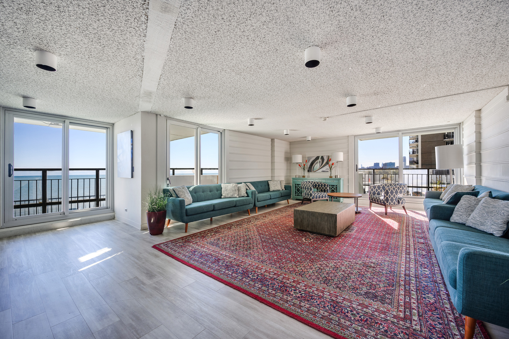 6033 North Sheridan Road, Unit 18K Chicago, IL 60660 - Photo 32 of 36 a living room with furniture or couch and a table