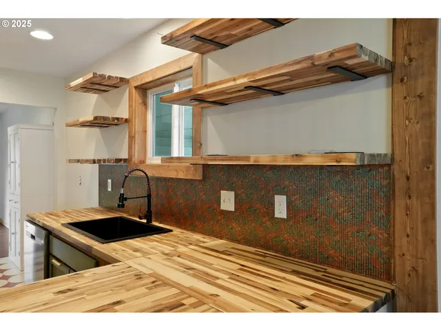 a kitchen with a stove and a refrigerator