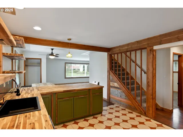 a kitchen with a sink and a refrigerator