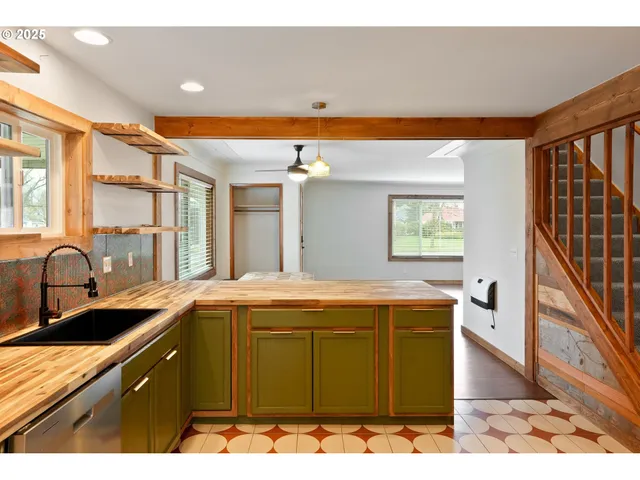 a kitchen with a sink and cabinets