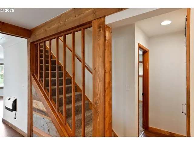 a kitchen with stainless steel appliances a refrigerator and a stove top oven