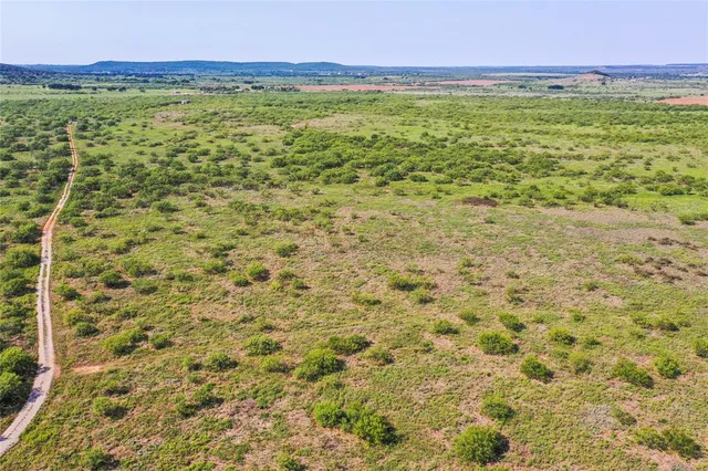 a view of a field with an outdoor space