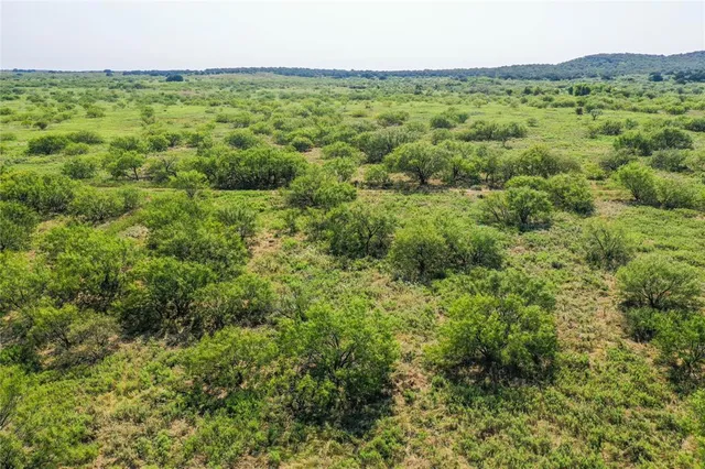 a view of a field with an outdoor space