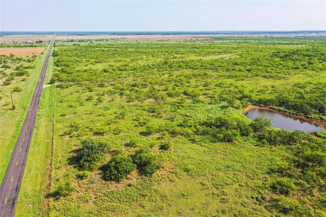a view of a field with an outdoor space