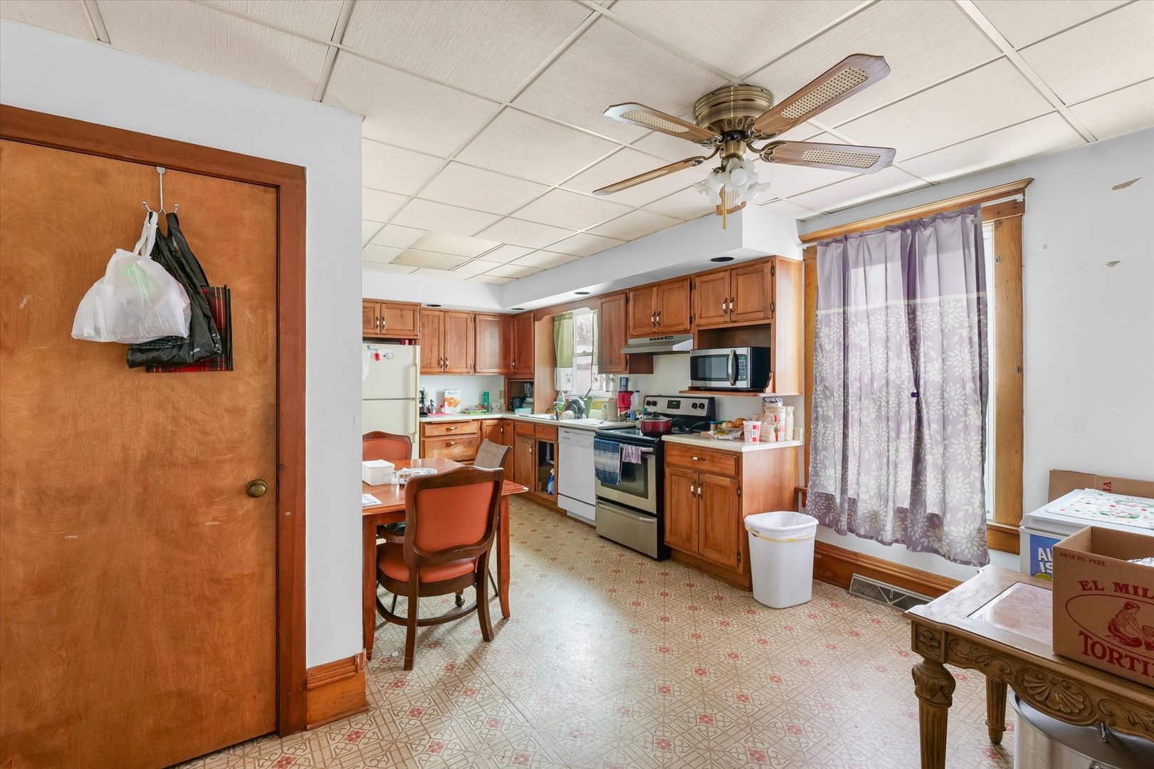 209 North Green Street Melvin, IL 60952 - Photo 12 of 24 a kitchen with a refrigerator and a sink