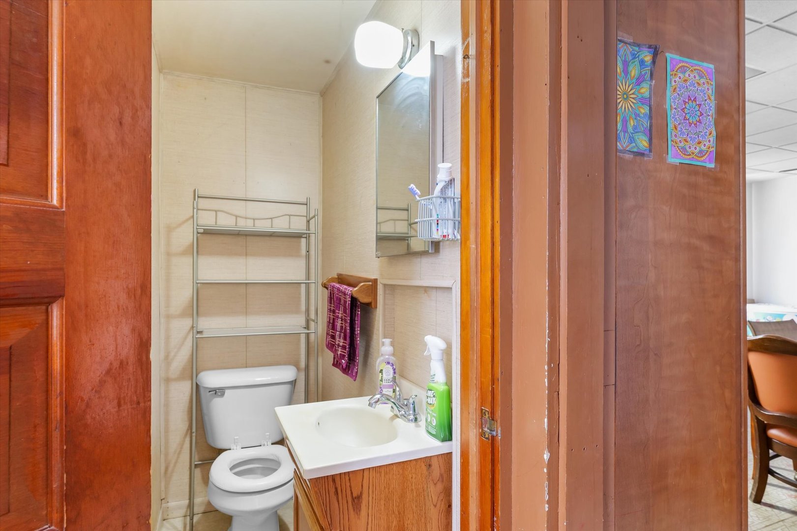 209 North Green Street Melvin, IL 60952 - Photo 14 of 24 a bathroom with a sink a toilet and shower curtain