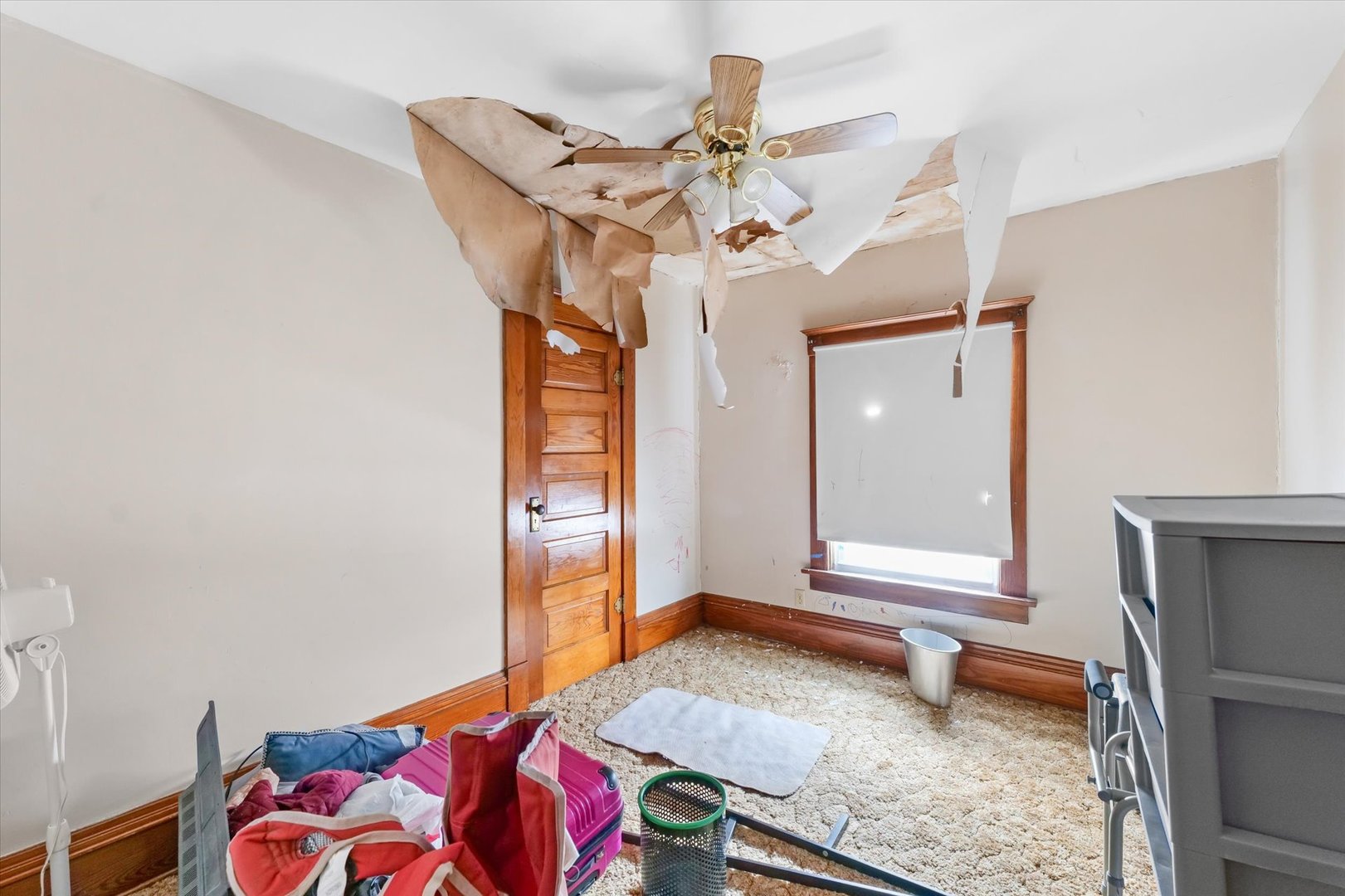 209 North Green Street Melvin, IL 60952 - Photo 15 of 24 a bedroom with a bed and a chandelier