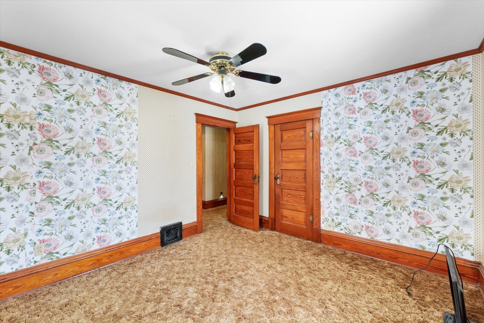 209 North Green Street Melvin, IL 60952 - Photo 18 of 24 a view of a big room with wooden floor closet and ceiling fan
