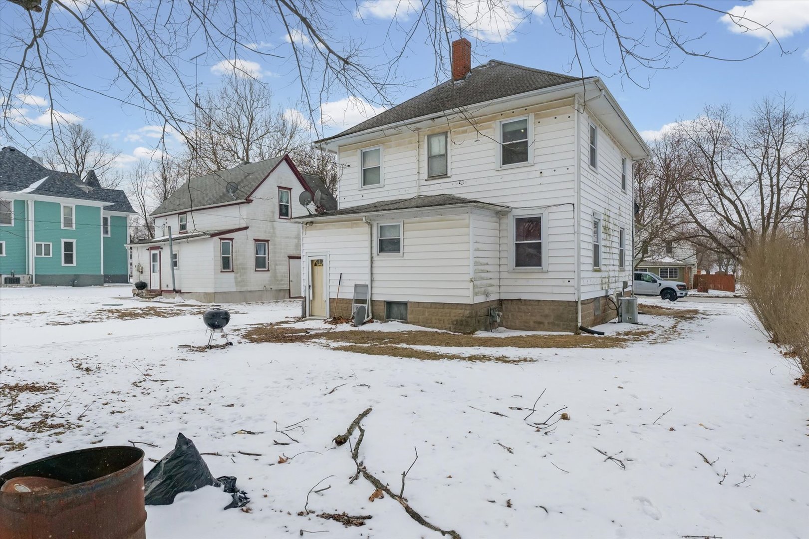 209 North Green Street Melvin, IL 60952 - Photo 21 of 24 a view of a house with a snow on the road