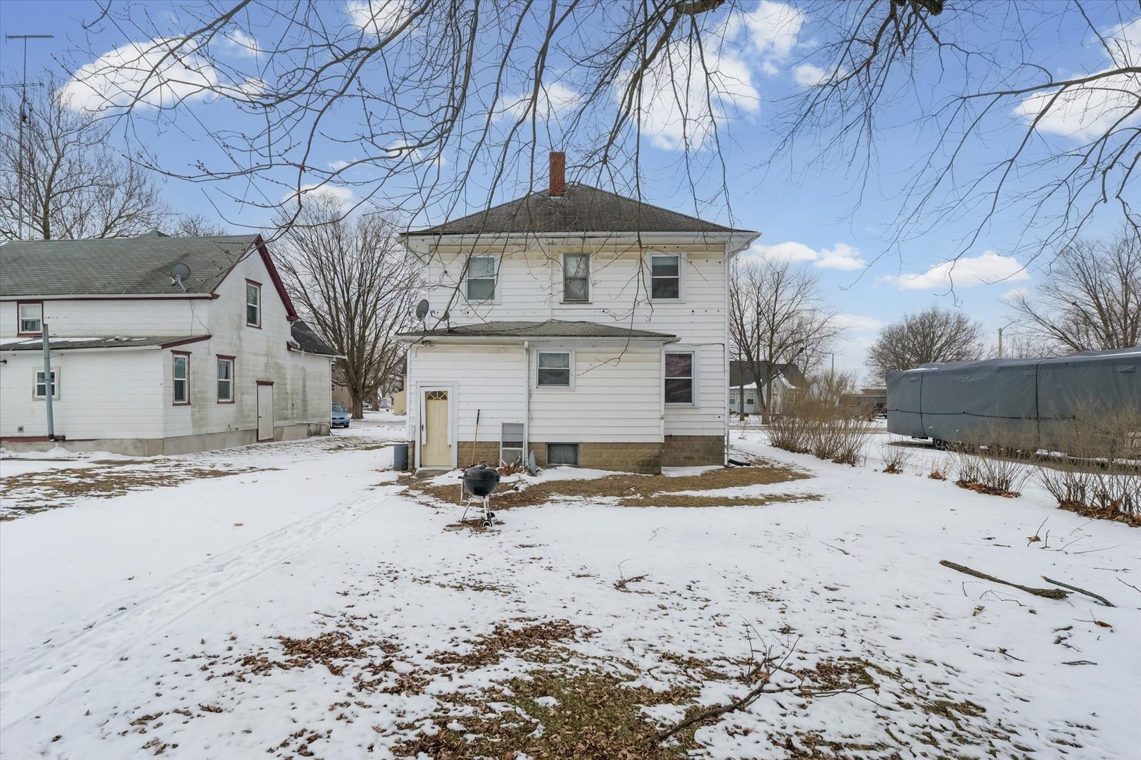 209 North Green Street Melvin, IL 60952 - Photo 22 of 24 a view of a house with a snow in the yard