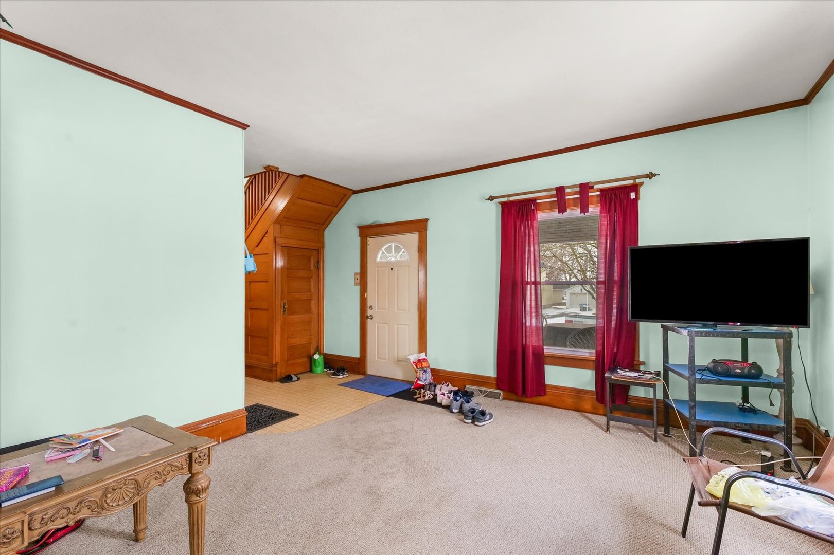 209 North Green Street Melvin, IL 60952 - Photo 6 of 24 a bedroom with furniture and a flat screen tv