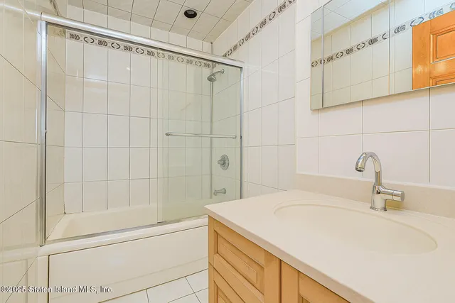 a bathroom with a sink and a shower