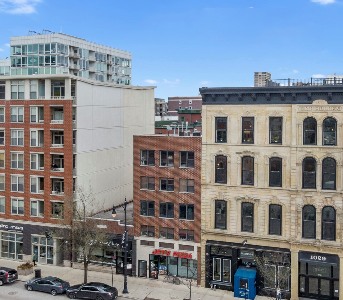 a front view of a building with a street