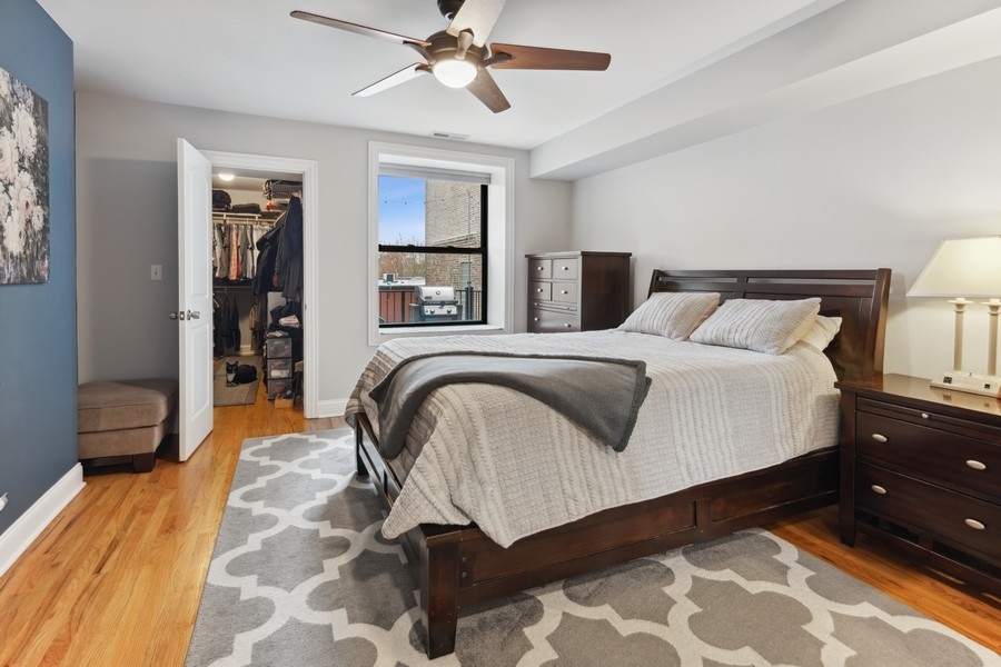 1025 West Madison Street, Unit 4 Chicago, IL 60607 - Photo 12 of 26 a bedroom with a bed and a walk in closet