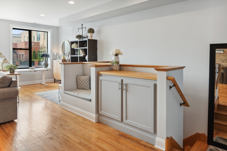 1025 West Madison Street, Unit 4 Chicago, IL 60607 - Photo 4 of 26 a living room with furniture and a large window