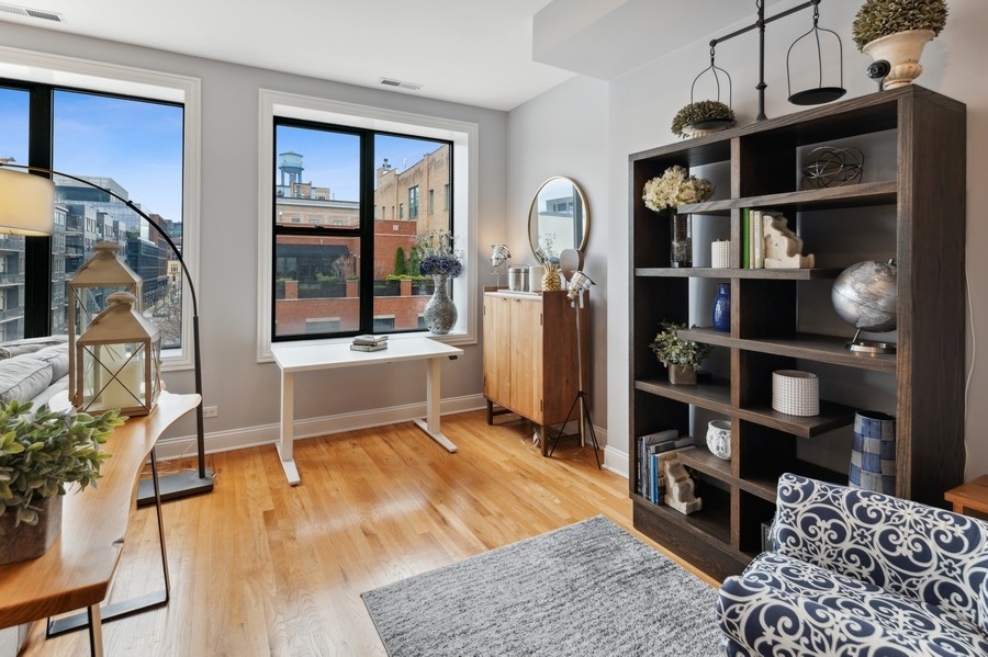 1025 West Madison Street, Unit 4 Chicago, IL 60607 - Photo 6 of 26 a living room with furniture a rug and a window