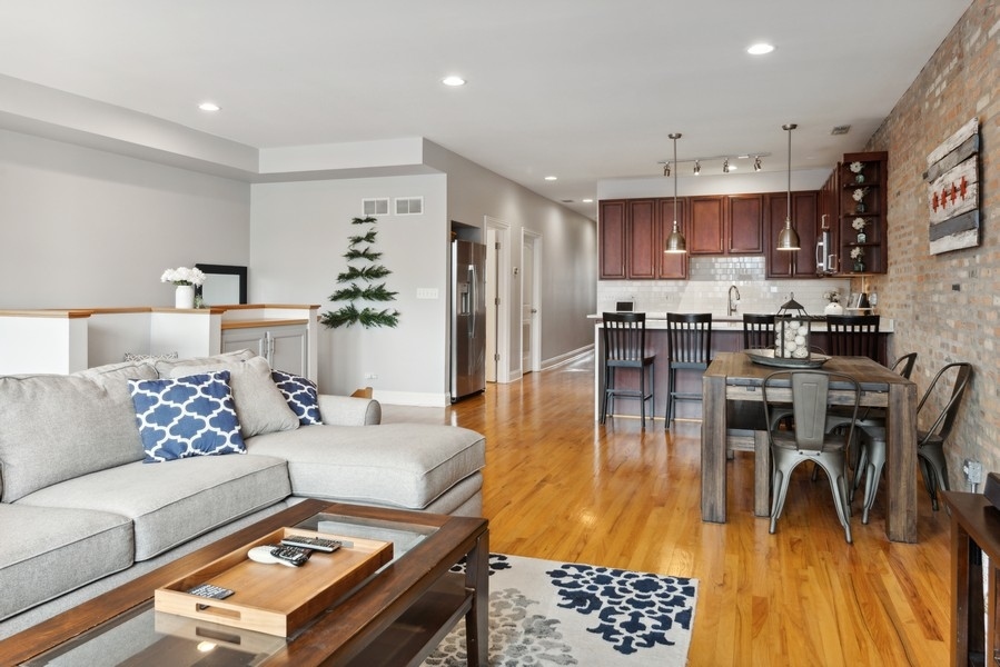 1025 West Madison Street, Unit 4 Chicago, IL 60607 - Photo 7 of 26 a living room with furniture and a table