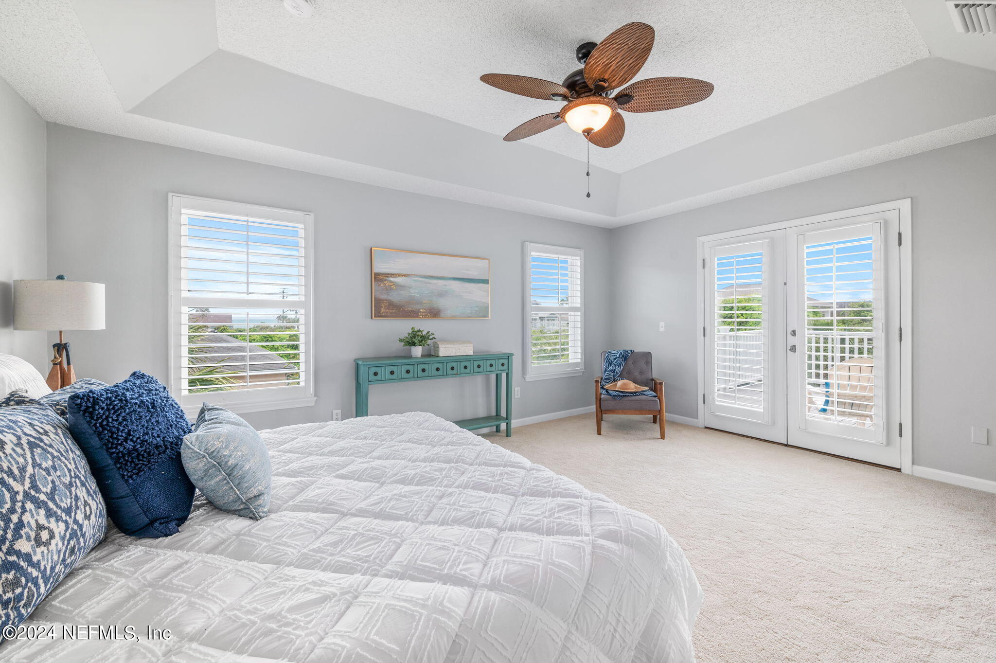 136 Beachside Drive Ponte Vedra Beach, FL 32082 - Photo 14 of 23 a large bed sitting in a bedroom next to a window