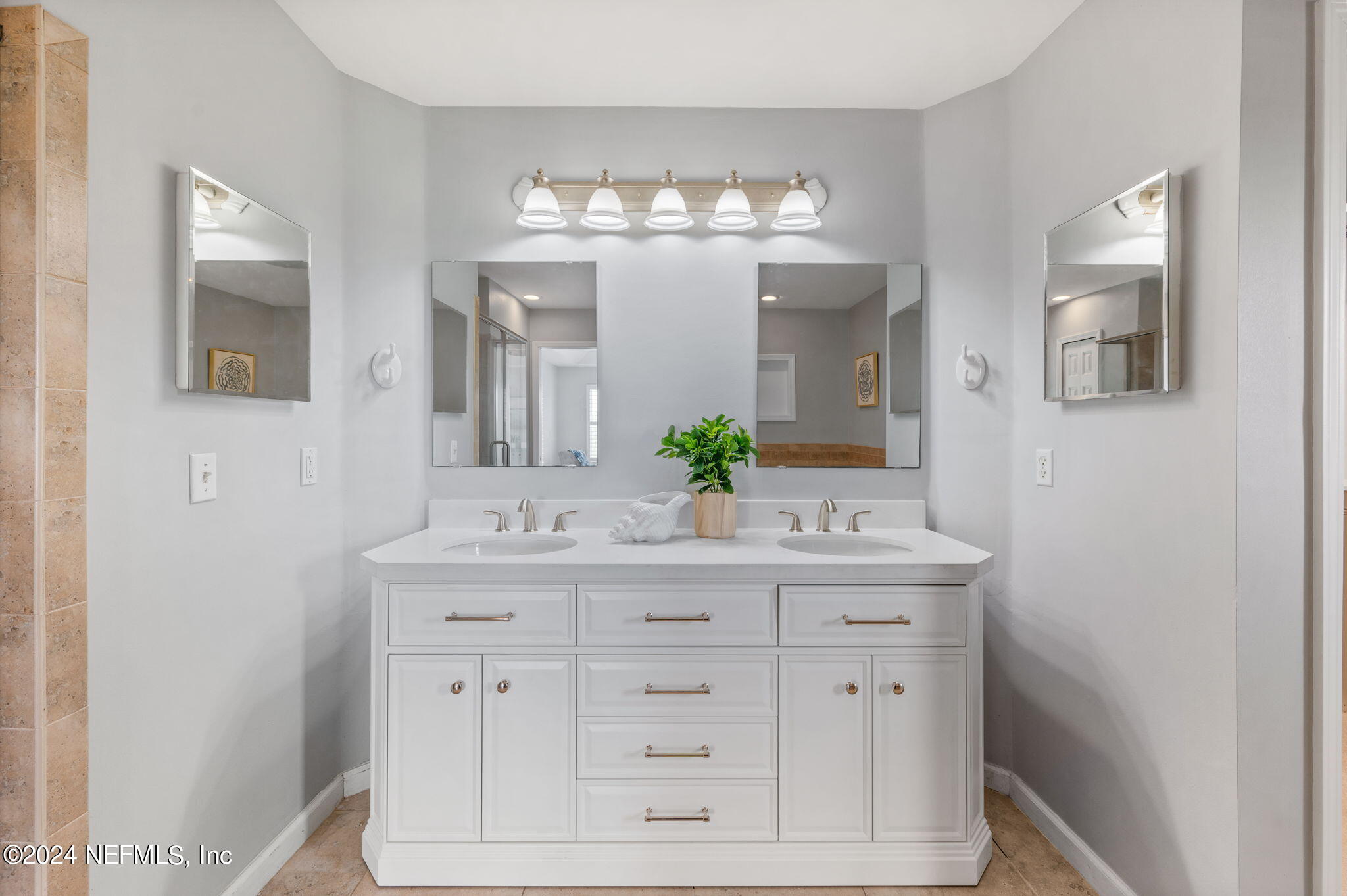136 Beachside Drive Ponte Vedra Beach, FL 32082 - Photo 16 of 23 a bathroom with a sink vanity and a mirror