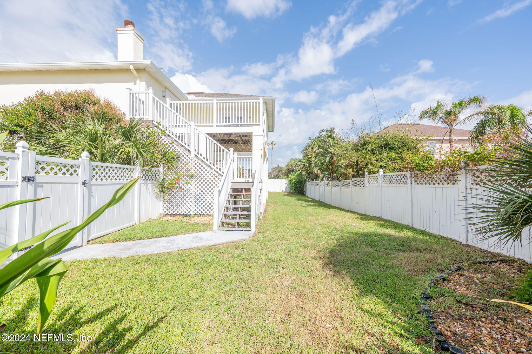 136 Beachside Drive Ponte Vedra Beach, FL 32082 - Photo 22 of 23 a view of a house with a yard