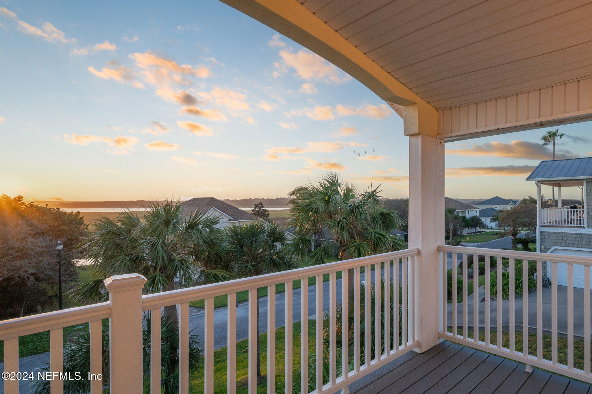 136 Beachside Drive Ponte Vedra Beach, FL 32082 - Photo 4 of 23 a view of a balcony with wooden fence and floor