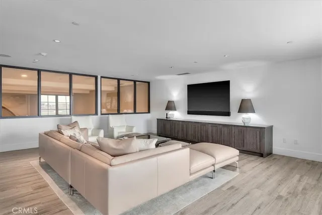 a kitchen with stainless steel appliances a sink a stove and a wooden floors