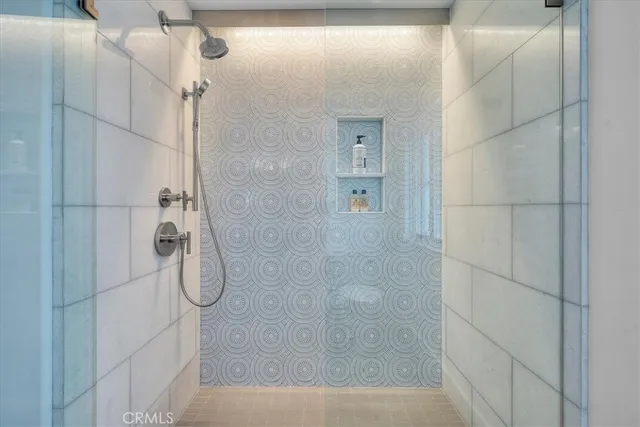 a bathroom with double sink and shower