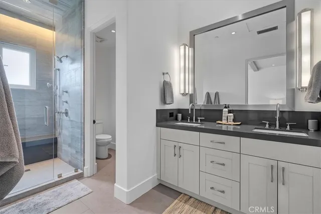 a living room with lots of furniture and kitchen view