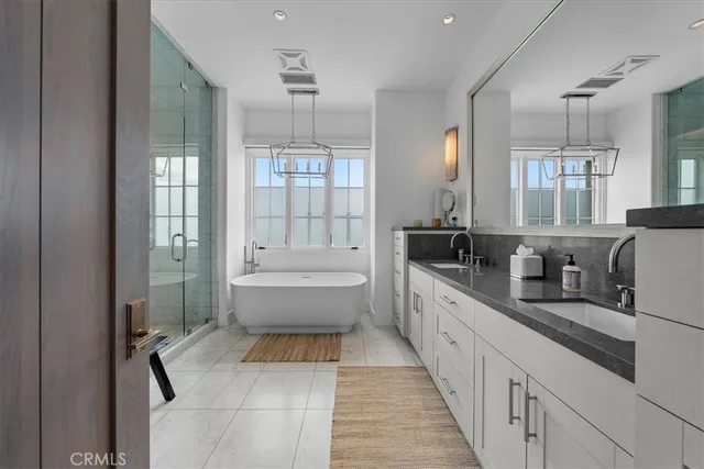 a dining room with furniture and a floor to ceiling window