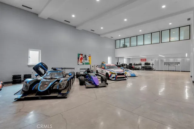a kitchen with cabinets and wooden floor