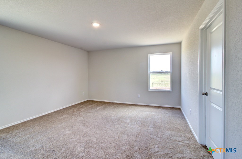 11242 Prairie Landing Converse, TX 78109 - Photo 12 of 24 an empty room with windows