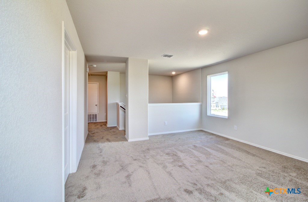 11242 Prairie Landing Converse, TX 78109 - Photo 15 of 24 a view of a big room with windows and chandelier fan