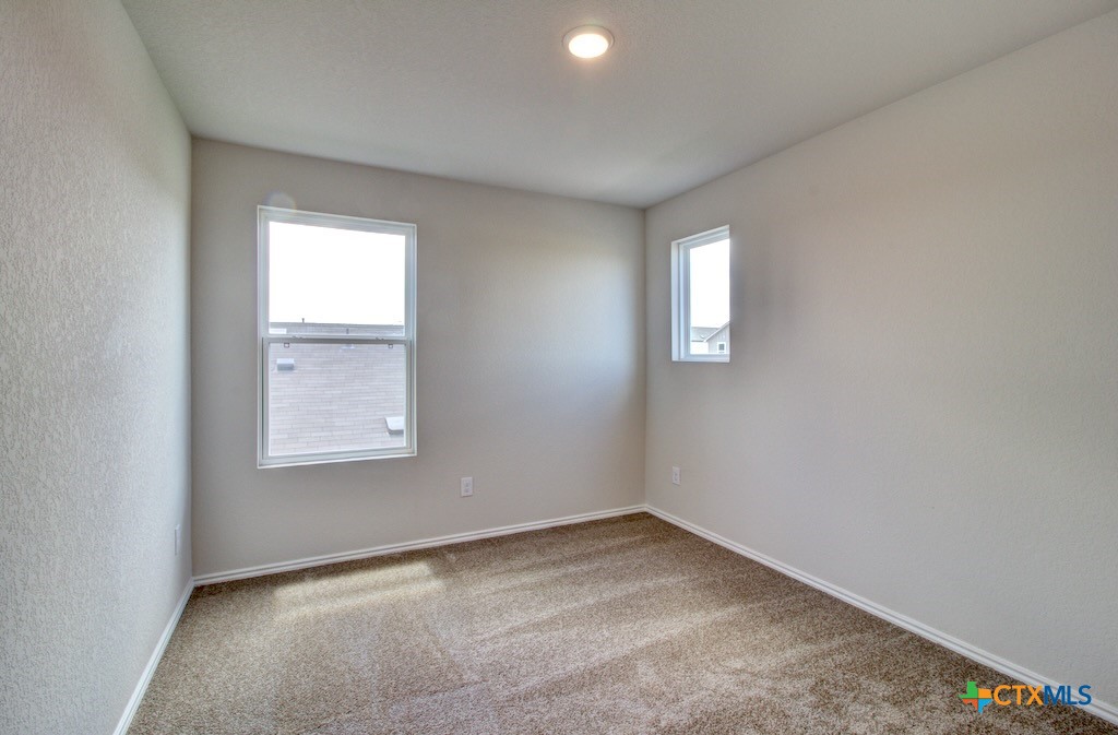 11242 Prairie Landing Converse, TX 78109 - Photo 21 of 24 an empty room with a window