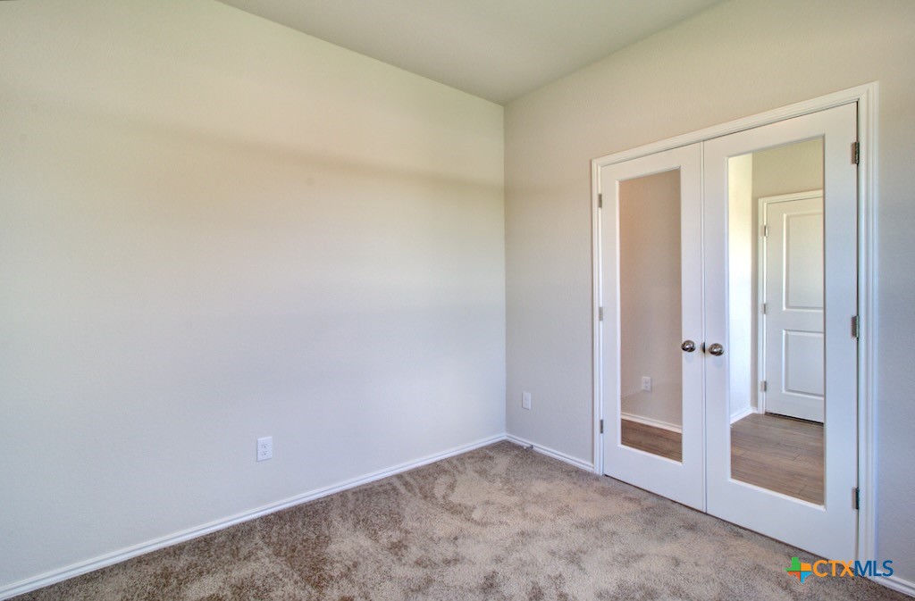11242 Prairie Landing Converse, TX 78109 - Photo 3 of 24 an empty room with an entryway