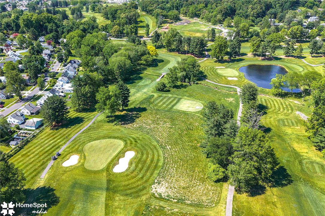 415 Willow Road Hellertown, PA 18055 - Photo 8 of 25 Overlooking manicured greens and fairways, this property offers serene golf course views and a tranquil neighborhood setting.