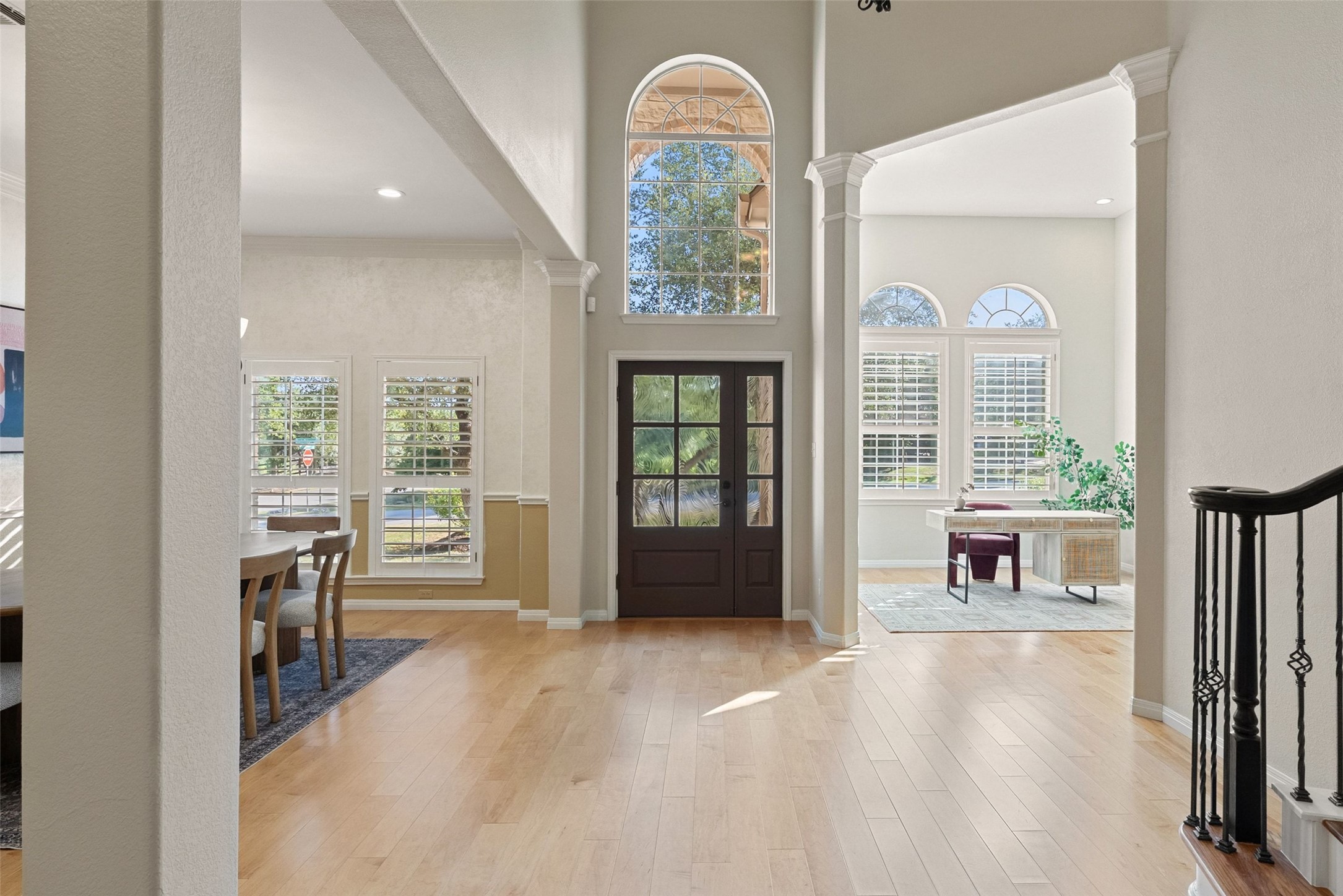 8215 Dark Ridge Cove Austin, TX 78737 - Photo 6 of 40 The graceful entry with an arched transom window provides a welcoming entry to this grand home.
