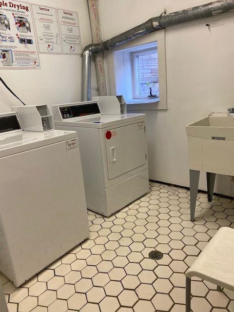 73 Madison Street, Unit 1N Hoboken, NJ 07030 - Photo 16 of 17 a utility room with dryer and washer