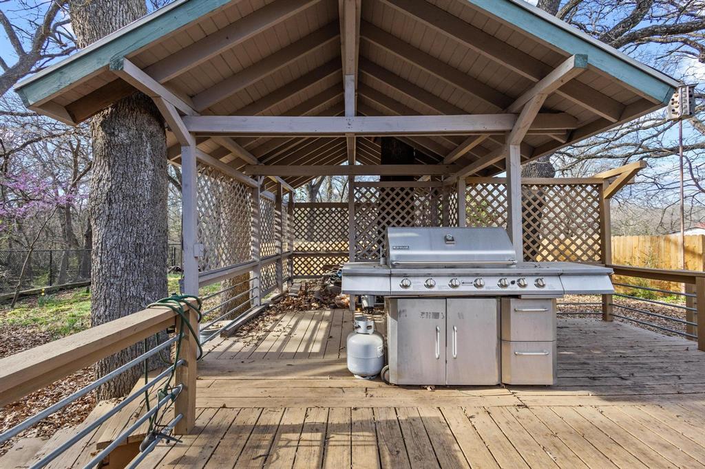1053 Paradise Cove Road Pottsboro, TX 75076 - Photo 29 of 35 View of wooden terrace with grill and hot tub