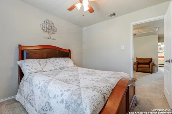 a bedroom with a bed and dresser