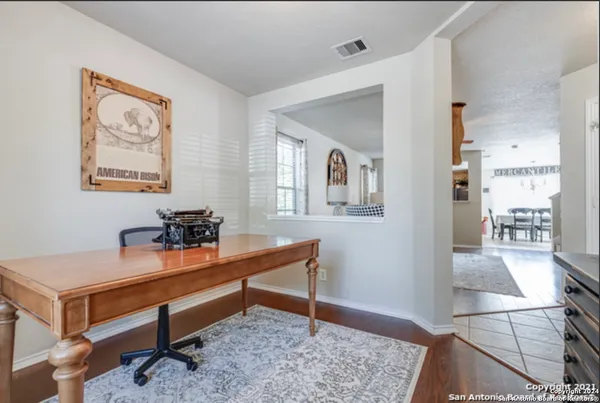 a room with a table and chairs